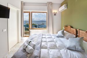A bed or beds in a room at Relais Lo Stagnone