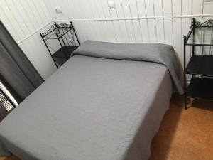 Łóżko lub łóżka w pokoju w obiekcie Hostal Alcobia