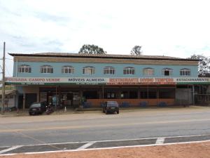 a building on the side of a street at Vitor Moreira pousada campo verde ltda in São João del Rei