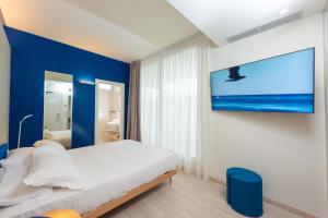 Llit o llits en una habitació de Amarina Hotel