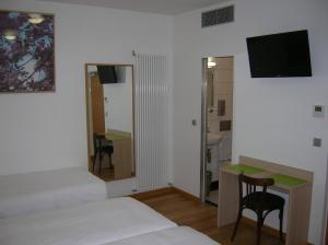 Postel nebo postele na pokoji v ubytování Hotel Darcet