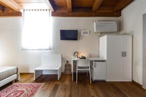 TV a/nebo společenská místnost v ubytování CASA MULINO