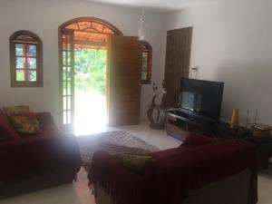 Televisyen dan/atau pusat hiburan di Meu cantinho na serra