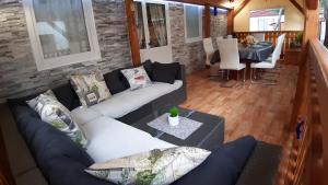 an overhead view of a living room with a couch and a table at Mobile home Lučan in Drage
