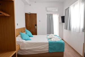 Voodi või voodid majutusasutuse Pyramos Hotel toas