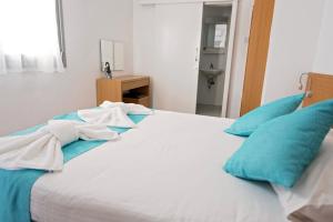 Voodi või voodid majutusasutuse Pyramos Hotel toas