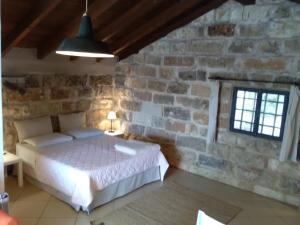 Ένα ή περισσότερα κρεβάτια σε δωμάτιο στο Casetta Vacanza in Campagna