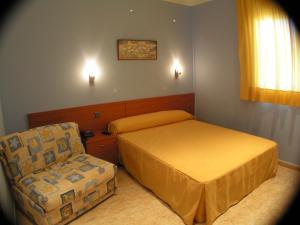 A bed or beds in a room at Hotel Zaytun