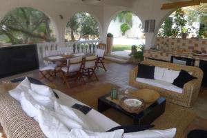 a living room with a couch and a table at Apartments Lorenandreja in Rab
