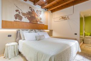 Postel nebo postele na pokoji v ubytování Vecchia Verona Rooms & Apartments