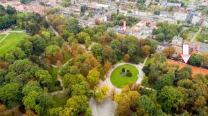 an aerial view of a park with trees and a building at Apartamenty Czestochowa Eu "parking gratis" in Częstochowa +108 photos