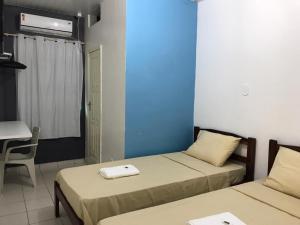 Tempat tidur dalam kamar di HOTEL XENIOS