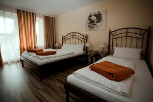 Postel nebo postele na pokoji v ubytování Apartments Hotel Petersburg