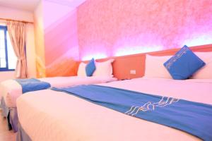 Uma cama ou camas num quarto em Yujian Kending Tese Homestay