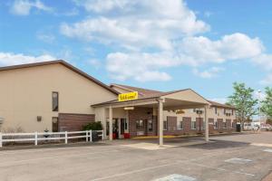 an empty parking lot in front of a motel at Super 8 by Wyndham North Platte in North Platte