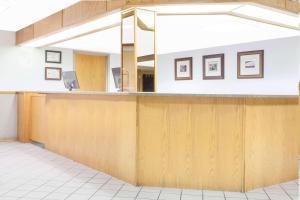 an empty waiting room with a counter in a hospital at Super 8 by Wyndham Kenora in Kenora