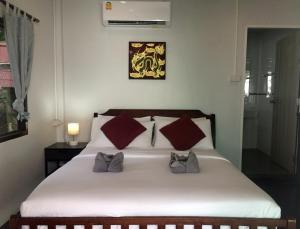 Postel nebo postele na pokoji v ubytování Sunrise Villas Seaview