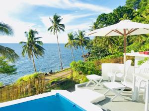 a view of the ocean from the patio of a villa at Bintana Sa Paraiso in Mambajao +263 photos
