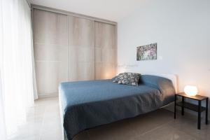 Postel nebo postele na pokoji v ubytování Aesthetic Apartments