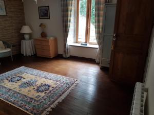 Postel nebo postele na pokoji v ubytování le jardin des chênes