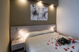 Rúm í herbergi á Hotel Scacciapensieri