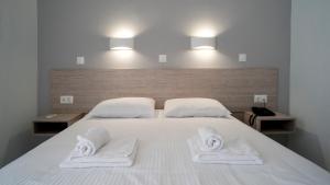 Posteľ alebo postele v izbe v ubytovaní Domenica Apartments