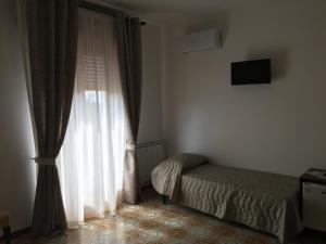 Postel nebo postele na pokoji v ubytování Al Chiaro Di Luna