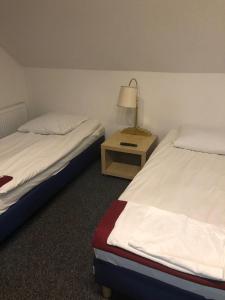 Postel nebo postele na pokoji v ubytování Pensjonat Pod Strzechą