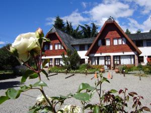 a house with a rose in front of it at Villa San Ignacio in San Carlos de Bariloche