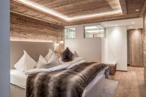 Łóżko lub łóżka w pokoju w obiekcie Sport- und Genusshotel Silvretta