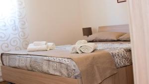 Ένα ή περισσότερα κρεβάτια σε δωμάτιο στο Terrazza sul Mediterraneo