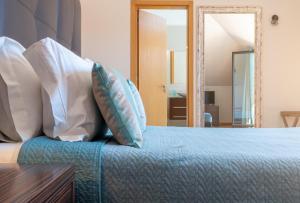 Cama o camas de una habitación en Deluxe 4 bedroom Apartment