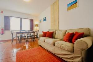 a living room with a couch and a table at Casa Paulo - Baleal beach, Terrace in Baleal