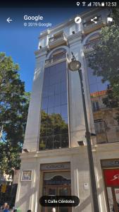 a building with a street light in front of it at Soho Apartment Principal Avenue in Málaga