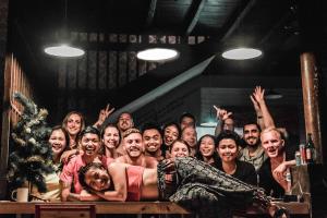 a group of people in a theatre posing for a picture at Da Housetel Kuta in Kuta