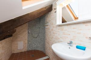 a bathroom with a sink and a shower at Bed & Breakfast La Mansarda in Naples +26 photos