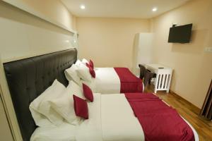 Posteľ alebo postele v izbe v ubytovaní Hotel Wayanad Square