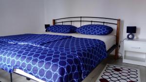 Postel nebo postele na pokoji v ubytování Apartments ZP44