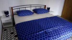 Postel nebo postele na pokoji v ubytování Apartments ZP44