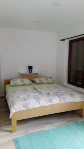 Postel nebo postele na pokoji v ubytování Apartments ZP44