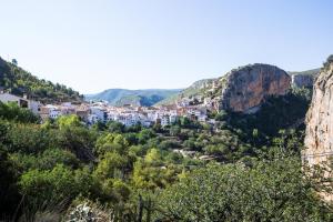 a view of a town in the mountains at Casa Valle del Turia in Chulilla