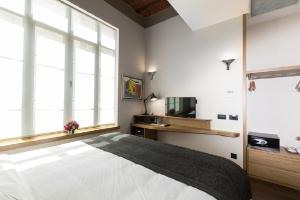 a bedroom with a large bed and a large window at Bankerhan Hotel Galata - Special Category in Istanbul
