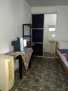TV a/nebo společenská místnost v ubytování Pousada Orquídea
