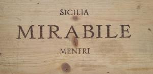 a wooden sign with the word merkel on it at Relais Casa Mirabile in Menfi