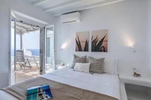 Posteľ alebo postele v izbe v ubytovaní Villa Tonic by Mykonos Mood