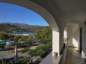 a view of a city from the balcony of a building at Soleil Corse in Saint-Florent