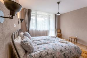 Postel nebo postele na pokoji v ubytování Homey Milka Apart up to 6 ppl Visit Velingrad Centre