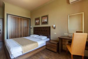 Letto o letti in una camera di Kantar Hotel