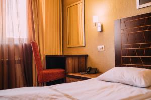 Letto o letti in una camera di Kantar Hotel