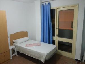 Hostal Casa de Huéspedes San Fernando - Adults Only客房内的一张或多张床位